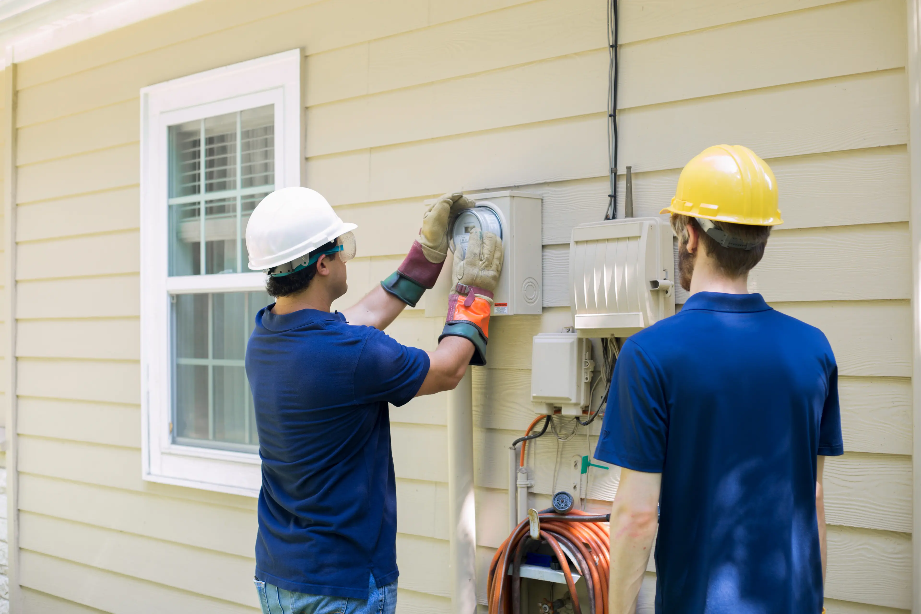 Service technicians at work on a home